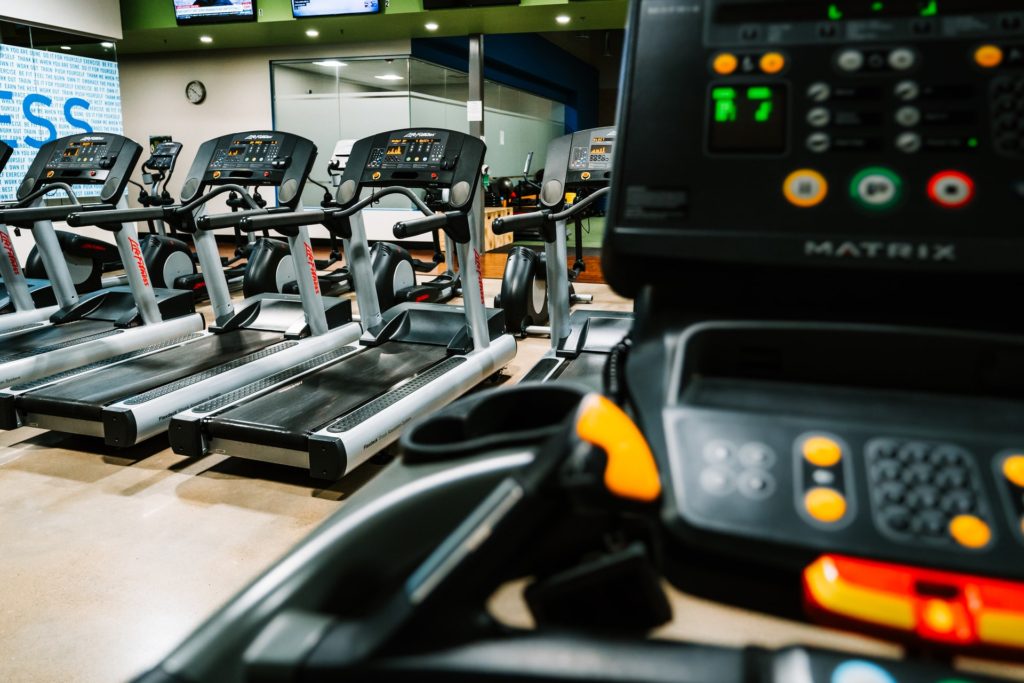 Several treadmills are displayed, some of the best home exercise equipment for weight loss.